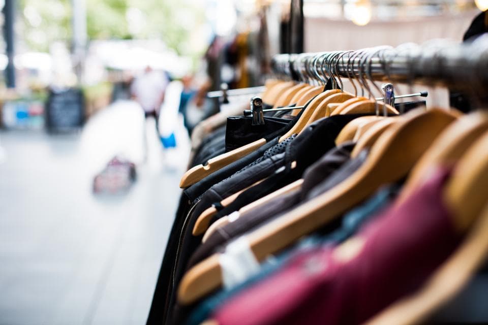 Rack of clothes on hangers in a retail store